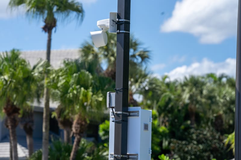 Camera mounted on a pole along a community road